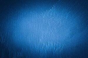 Blue decorative plaster texture with vignette. Abstract grunge background with copy space. photo