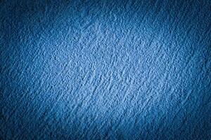 Blue decorative plaster texture with vignette. Abstract grunge background with copy space. photo