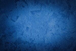 Blue decorative plaster texture with vignette. Abstract grunge background with copy space. photo