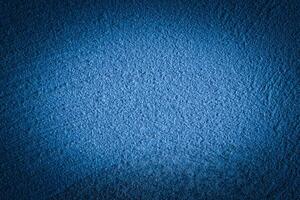 Blue decorative plaster texture with vignette. Abstract grunge background with copy space. photo