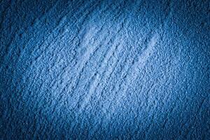 Blue decorative plaster texture with vignette. Abstract grunge background with copy space. photo