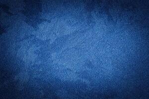 Blue decorative plaster texture with vignette. Abstract grunge background with copy space. photo