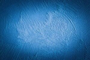 Blue decorative plaster texture with vignette. Abstract grunge background with copy space. photo