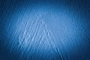 Blue decorative plaster texture with vignette. Abstract grunge background with copy space. photo