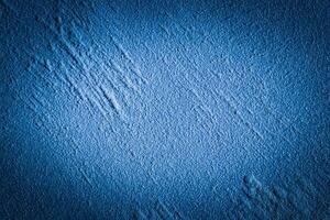 Blue decorative plaster texture with vignette. Abstract grunge background with copy space. photo