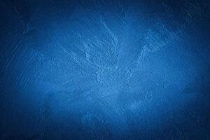 Blue decorative plaster texture with vignette. Abstract grunge background with copy space. photo