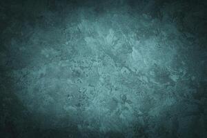 Cyan decorative plaster texture with vignette. Abstract grunge background with copy space. photo