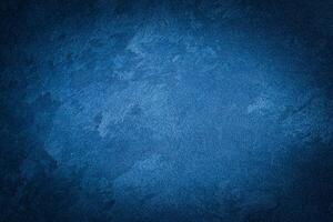 Blue decorative plaster texture with vignette. Abstract grunge background with copy space. photo