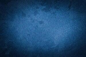 Blue decorative plaster texture with vignette. Abstract grunge background with copy space. photo