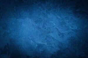 Blue decorative plaster texture with vignette. Abstract grunge background with copy space. photo