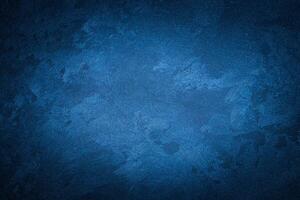 Blue decorative plaster texture with vignette. Abstract grunge background with copy space. photo
