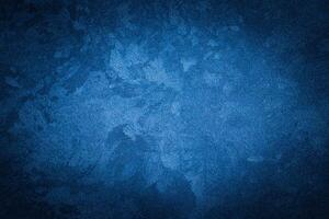 Blue decorative plaster texture with vignette. Abstract grunge background with copy space. photo