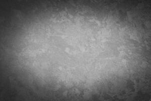 Gray decorative plaster texture with vignette. Abstract grunge background with copy space. photo