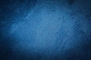 Blue decorative plaster texture with vignette. Abstract grunge background with copy space. photo