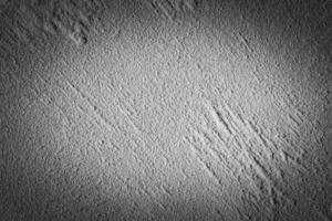 Gray decorative plaster texture with vignette. Abstract grunge background with copy space. photo
