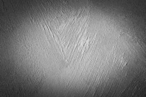 Gray decorative plaster texture with vignette. Abstract grunge background with copy space. photo
