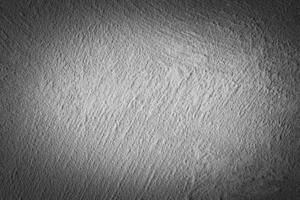 Gray decorative plaster texture with vignette. Abstract grunge background with copy space. photo