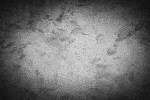 Gray decorative plaster texture with vignette. Abstract grunge background with copy space. photo