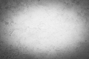 Gray decorative plaster texture with vignette. Abstract grunge background with copy space. photo