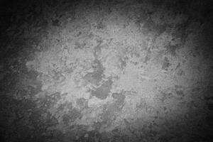 Gray decorative plaster texture with vignette. Abstract grunge background with copy space. photo