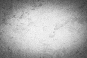 Gray decorative plaster texture with vignette. Abstract grunge background with copy space. photo