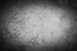 Gray decorative plaster texture with vignette. Abstract grunge background with copy space. photo