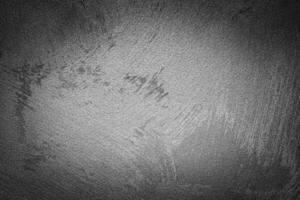 Gray decorative plaster texture with vignette. Abstract grunge background with copy space. photo