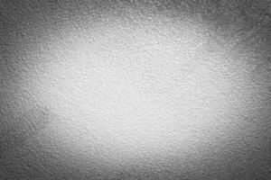 Gray decorative plaster texture with vignette. Abstract grunge background with copy space. photo