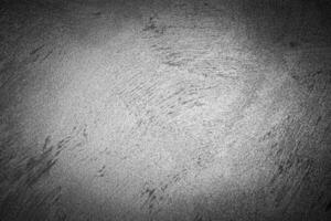 Gray decorative plaster texture with vignette. Abstract grunge background with copy space. photo