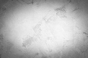 Gray decorative plaster texture with vignette. Abstract grunge background with copy space. photo