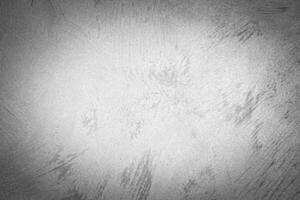 Gray decorative plaster texture with vignette. Abstract grunge background with copy space. photo
