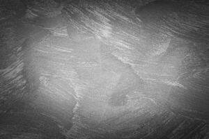 Gray decorative plaster texture with vignette. Abstract grunge background with copy space. photo