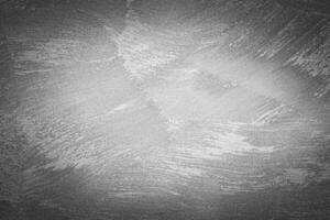 Gray decorative plaster texture with vignette. Abstract grunge background with copy space. photo