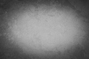 Gray decorative plaster texture with vignette. Abstract grunge background with copy space. photo
