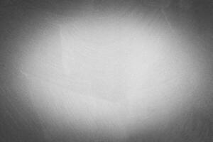 Gray decorative plaster texture with vignette. Abstract grunge background with copy space. photo