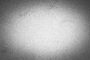Gray decorative plaster texture with vignette. Abstract grunge background with copy space. photo