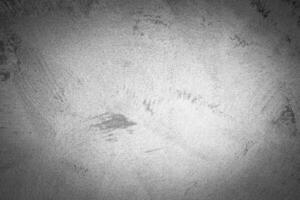 Gray decorative plaster texture with vignette. Abstract grunge background with copy space. photo