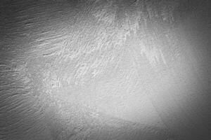 Gray decorative plaster texture with vignette. Abstract grunge background with copy space. photo