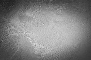 Gray decorative plaster texture with vignette. Abstract grunge background with copy space. photo