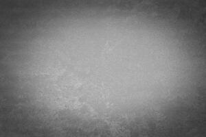 Gray decorative plaster texture with vignette. Abstract grunge background with copy space. photo