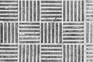 Top view on paving stone road. Old pavement of concrete texture. Cobblestone sidewalk. Black and white abstract background for design. photo