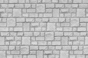 Black and white texture of a wall covered with decorative brick-like tiles. Abstract background for design. photo