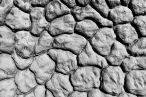Black and white texture of a wall made of stones. Abstract background. photo