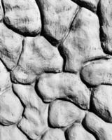 Black and white texture of a wall made of stones. Abstract background. photo