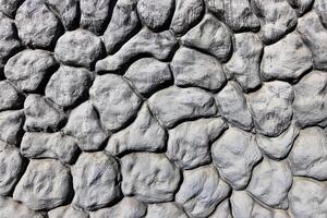 Black and white texture of a wall made of stones. Abstract background. photo
