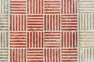 Top view on paving stone road. Old pavement of concrete texture. Cobblestone sidewalk. Abstract background for design. photo