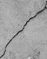 Black and white texture of cracked concrete wall or cement. photo