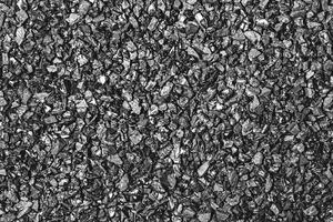 Close-up activated carbon texture. Coconut charcoal. photo