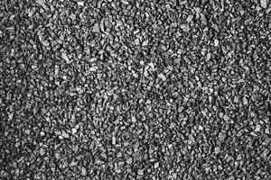Close-up activated carbon texture. Coconut charcoal. photo