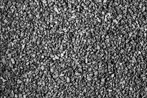 Close-up activated carbon texture. Coconut charcoal. photo